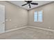 Neutral bedroom with a ceiling fan and natural light from the window with plantation shutters at 11274 Felice Cohn Ct, Las Vegas, NV 89179