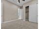 Neutral bedroom featuring a fan, closet, and an attached bathroom at 11274 Felice Cohn Ct, Las Vegas, NV 89179
