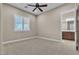 Neutral bedroom features a ceiling fan, plantation shutters and ensuite bath at 11274 Felice Cohn Ct, Las Vegas, NV 89179