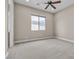 Bedroom with a ceiling fan and a window, offering plenty of natural light at 11274 Felice Cohn Ct, Las Vegas, NV 89179