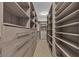 Spacious walk-in closet with ample shelving, drawers, and hanging space at 11274 Felice Cohn Ct, Las Vegas, NV 89179
