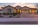 Charming single-story home with a well-manicured front yard and a paver driveway leading to a three-car garage at 11274 Felice Cohn Ct, Las Vegas, NV 89179