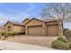 Lovely single-story home with a paver driveway leading to a three-car garage, complemented by manicured landscaping at 11274 Felice Cohn Ct, Las Vegas, NV 89179