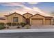 Charming single-story home boasts a three-car garage, desert landscaping, and a welcoming entrance at 11274 Felice Cohn Ct, Las Vegas, NV 89179