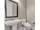 Classic half bathroom with pedestal sink and modern toilet at 11274 Felice Cohn Ct, Las Vegas, NV 89179