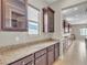 Spacious kitchen showcasing beautiful granite countertops, custom cabinets and stainless steel appliances, perfect for cooking at 11274 Felice Cohn Ct, Las Vegas, NV 89179