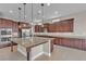 Gourmet kitchen features stainless steel appliances, a central island, and ample cabinet space for storage and meal preparation at 11274 Felice Cohn Ct, Las Vegas, NV 89179