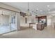 Open concept kitchen with backyard access, granite countertops, and stainless appliances for seamless indoor/outdoor living at 11274 Felice Cohn Ct, Las Vegas, NV 89179