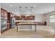 Well-lit kitchen with a large central island, stainless steel appliances, and generous counter space for cooking and entertaining at 11274 Felice Cohn Ct, Las Vegas, NV 89179