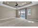 Open bedroom with pool view through sliding glass doors and recessed lights at 11274 Felice Cohn Ct, Las Vegas, NV 89179