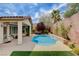 Relaxing backyard boasts a swimming pool, spa, mature trees, and covered patio at 11342 Early Sun Ct, Las Vegas, NV 89135
