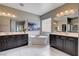 Bright bathroom with double vanities, soaking tub, and decorative picture window for natural light at 11342 Early Sun Ct, Las Vegas, NV 89135
