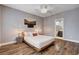 Inviting bedroom with wood floors, a platform bed, and neutral decor, creating a serene atmosphere at 11342 Early Sun Ct, Las Vegas, NV 89135