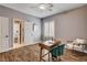 This bedroom features wood-look floors and neutral wall color at 11342 Early Sun Ct, Las Vegas, NV 89135