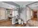 Open dining area features wood floors, stylish light fixture, and a view into the kitchen at 11342 Early Sun Ct, Las Vegas, NV 89135