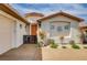 Close up of the front entry showcasing a private courtyard with a gated entrance and lush landscaping at 11342 Early Sun Ct, Las Vegas, NV 89135