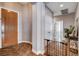 Interior shot showcasing an open hallway with beautiful hardwood floors and designer details at 11342 Early Sun Ct, Las Vegas, NV 89135