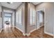 This hallway features wood-look floors and neutral colored walls at 11342 Early Sun Ct, Las Vegas, NV 89135