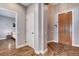 Open hallway view featuring stylish hardwood floors, modern paint colors, and natural light at 11342 Early Sun Ct, Las Vegas, NV 89135