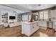 Spacious open-concept design connects the kitchen and living room, featuring stylish decor and ample natural light at 11342 Early Sun Ct, Las Vegas, NV 89135