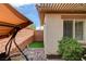 Enclosed patio area featuring a swing and decorative rock landscaping at 11342 Early Sun Ct, Las Vegas, NV 89135