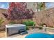 Relaxing spa and patio with an artistic foliage backdrop at 11342 Early Sun Ct, Las Vegas, NV 89135