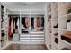 Well-organized walk-in closet with custom shelving, drawers, and ample storage space for clothes and accessories at 11342 Early Sun Ct, Las Vegas, NV 89135