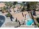 Stunning aerial view of a home featuring a sparkling kidney-shaped pool and a well-maintained tile roof at 124 Countrywood Cir, Las Vegas, NV 89107