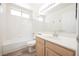 Bathroom features a tub/shower combo, single vanity, and tile flooring at 124 Countrywood Cir, Las Vegas, NV 89107