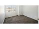 Bedroom features new carpet, white paint, and natural light from the window at 124 Countrywood Cir, Las Vegas, NV 89107