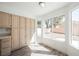 Bright dining area with ample windows providing natural light and a view to the backyard at 124 Countrywood Cir, Las Vegas, NV 89107
