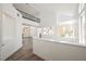 Bright living room featuring wood floors, a modern staircase and railing, with lots of natural light at 124 Countrywood Cir, Las Vegas, NV 89107
