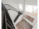 Birds eye view of the modern staircase, chandelier and natural light from the large windows at 124 Countrywood Cir, Las Vegas, NV 89107