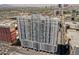 Aerial view of condo building in an urban setting, showcasing surrounding city views and location at 150 N Las Vegas Blvd # 818, Las Vegas, NV 89101