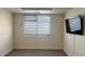 Bedroom with a mounted TV and modern window shade at 150 N Las Vegas Blvd # 818, Las Vegas, NV 89101