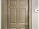 Condo entry door with a modern handle and a unit number 818 sign on a neutral colored wall at 150 N Las Vegas Blvd # 818, Las Vegas, NV 89101