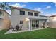 Exterior view of the two-story home featuring backyard, patio, and sunroom at 1677 Balsam Mist Ave, Las Vegas, NV 89183