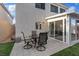 Outdoor dining on the patio adjacent to the home's sunroom and lawn at 1677 Balsam Mist Ave, Las Vegas, NV 89183