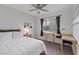 Bedroom features a queen bed, carpeted flooring, a ceiling fan, and natural lighting at 1677 Balsam Mist Ave, Las Vegas, NV 89183