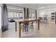 A dining area sits off the kitchen and boasts a table with seating under two large windows at 1677 Balsam Mist Ave, Las Vegas, NV 89183