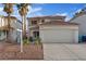 Inviting home with manicured landscaping, two car garage, and a terracotta tile roof at 1677 Balsam Mist Ave, Las Vegas, NV 89183