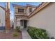 Inviting front entrance, desert landscaping and walkway to the front door of the home at 1677 Balsam Mist Ave, Las Vegas, NV 89183