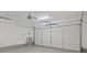 Spacious garage with ample storage and a large automatic door at 1677 Balsam Mist Ave, Las Vegas, NV 89183