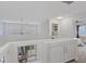 Bright hallway with white cabinets and views of the patio and bedroom at 1677 Balsam Mist Ave, Las Vegas, NV 89183
