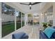Relaxing sunroom with comfortable seating and panoramic backyard views at 1677 Balsam Mist Ave, Las Vegas, NV 89183