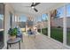 Bright sunroom with wall-to-wall windows offering views of the backyard at 1677 Balsam Mist Ave, Las Vegas, NV 89183