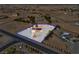 Aerial view of a large property with a home with solar panels in a desert landscape and mountain backdrop at 1800 Red Rock Dr, Pahrump, NV 89048