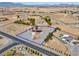 Expansive lot with a single-Gathering home featuring a red roof and solar panels in a rural setting at 1800 Red Rock Dr, Pahrump, NV 89048