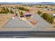 Aerial view of large property with a house, outbuildings, and ample parking at 1800 Red Rock Dr, Pahrump, NV 89048