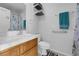 Bathroom featuring a white-tiled countertop, shower, and decorative towel at 1800 Red Rock Dr, Pahrump, NV 89048